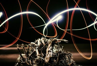 Low angle view of illuminated ferris wheel