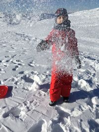 Rear view of boy on snow