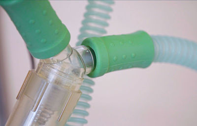 Close-up of camera over white background