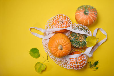 High angle view of fruits in basket on table