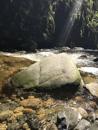 Scenic view of river amidst rocks