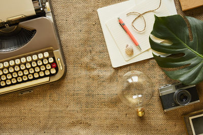 High angle view of mobile phone and book on table