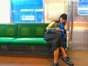 Boy sitting in corridor