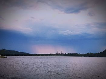 View of city against cloudy sky