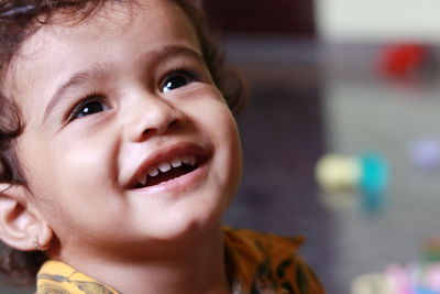 A close-up picture of a child in which the child is seen laughing