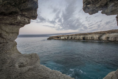 Scenic view of sea against cloudy sky