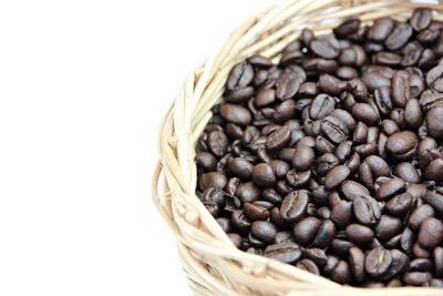 Close-up of coffee beans on white background