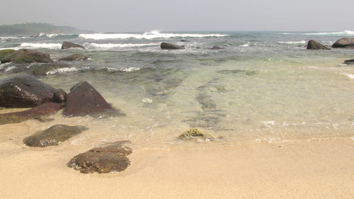 Scenic view of beach against sky