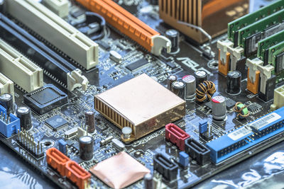 Close-up of computer mother board with radiator in center