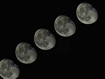 Digital composite image of moon against sky at night