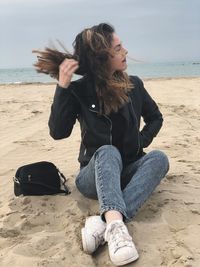 Woman sitting on beach