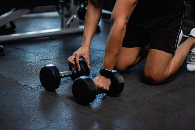 Low section of man exercising in gym