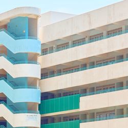 Low angle view of modern building against blue sky