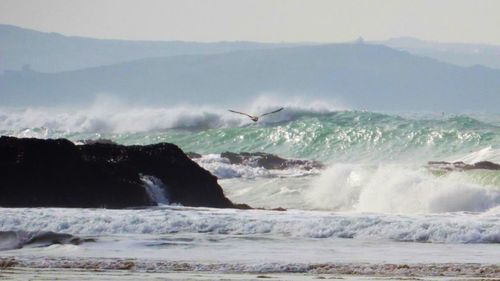 Waves splashing on rocks