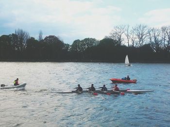 People on boat in lake