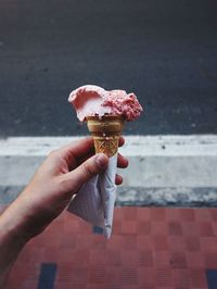 Midsection of woman holding ice cream