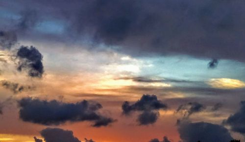 Low angle view of dramatic sky during sunset