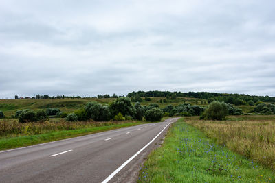 Landscape with an asphalt road in the countryside. empty road to the hills.
