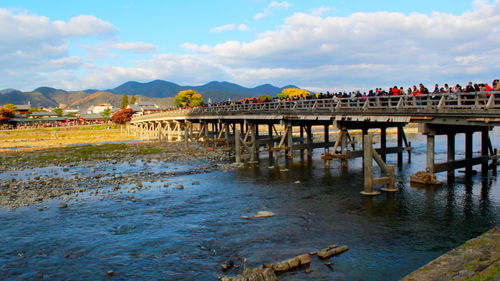 Pier over river against sky