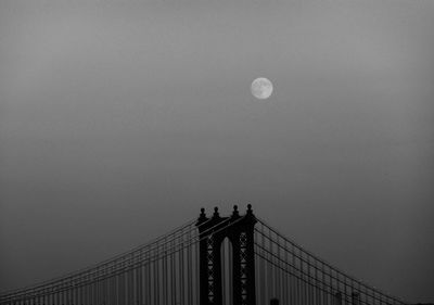 Low angle view of moon against sky at night