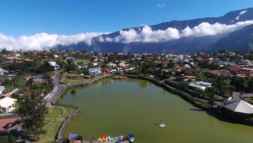 High angle view of townscape and bay against sky