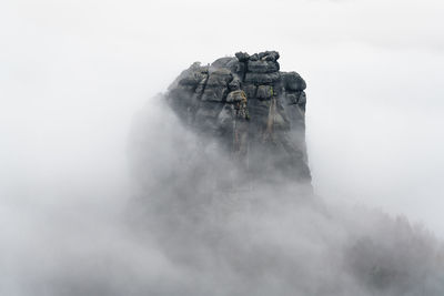 Scenic view of waterfall against sky