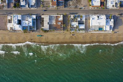 Water flowing by sea against buildings