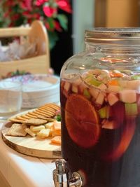 Close-up of ice cold drink in a giant glass container 