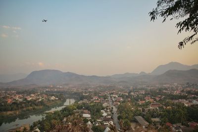 Aerial view of townscape against sky during sunset