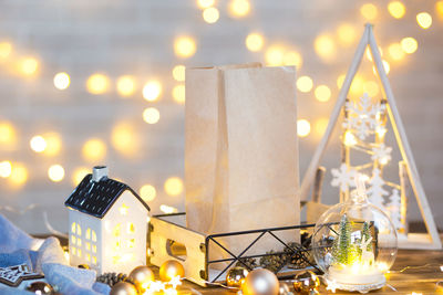 Illuminated christmas lights on table