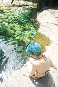 High angle view of woman swimming in pool