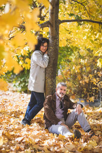 Portrait of a mature couple 50 years old in an autumn park.