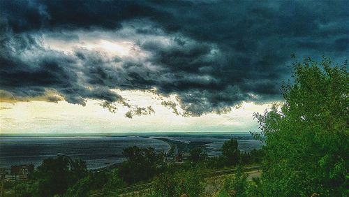 Scenic view of sea against cloudy sky