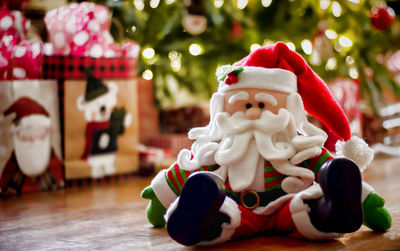 Close-up of santa claus on table during christmas