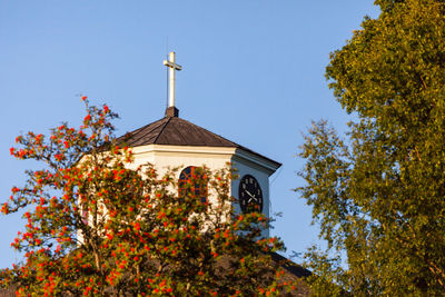 Low angle view of bell tower against clear sky