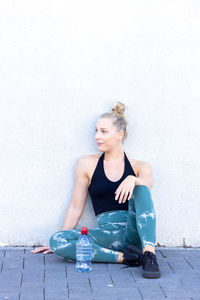 Portrait of cute girl sitting on floor