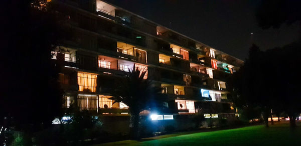 Buildings in city at night