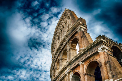 Low angle view of cathedral against cloudy sky