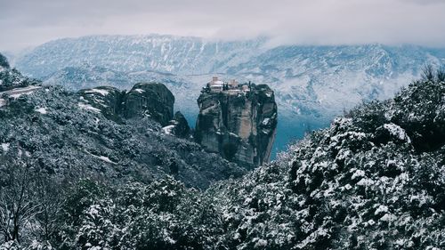 Panoramic view of snow covered mountain against sky