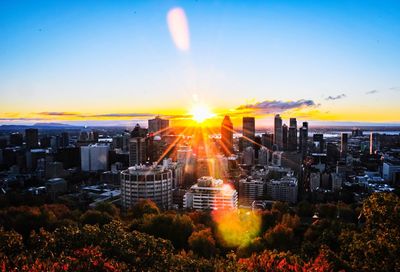 High angle view of buildings against sky during sunset