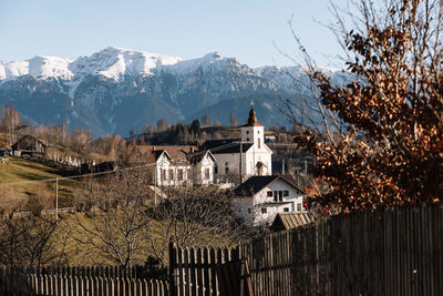 Houses and mountains against sky