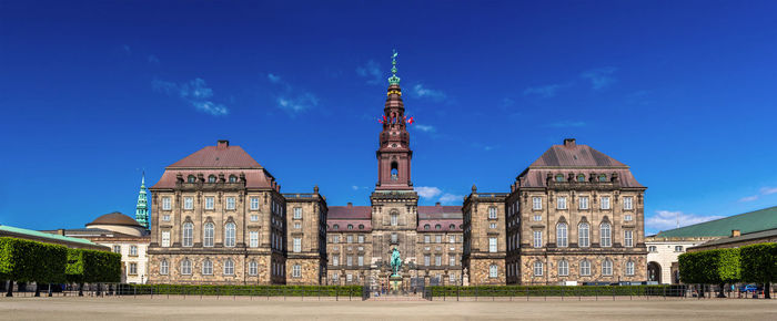 Facade of historic building against blue sky