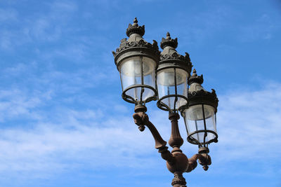 Low angle view of street light against sky