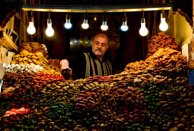Portrait of a man in market stall