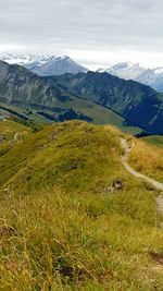 Scenic view of landscape and mountains against sky