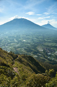 Scenic view of landscape and mountains against sky