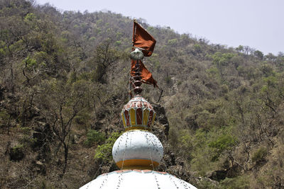 Traditional windmill against sky