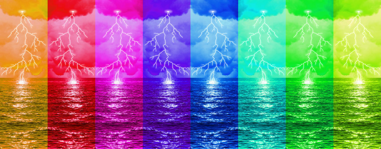 DIGITAL COMPOSITE IMAGE OF ILLUMINATED LIGHTS IN SEA