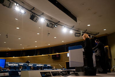 People working in illuminated room