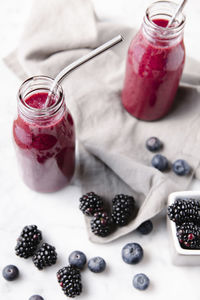 High angle view of dessert in jar on table